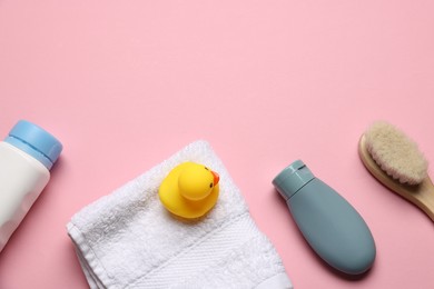 Photo of Baby bath accessories and cosmetic products on pink background, flat lay. Space for text