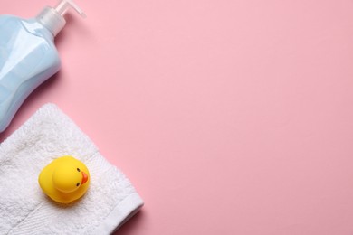 Photo of Baby bath accessories on pink background, flat lay. Space for text