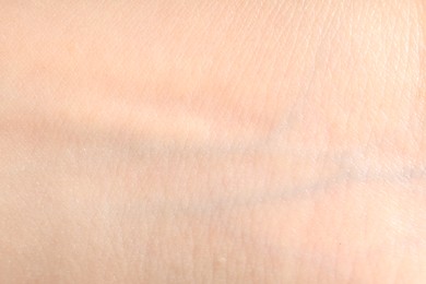 Photo of Human skin, closeup view. Detailed texture of surface