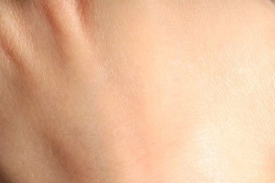Photo of Human skin, closeup view. Detailed texture of surface