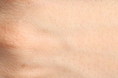 Photo of Human skin, closeup view. Detailed texture of surface
