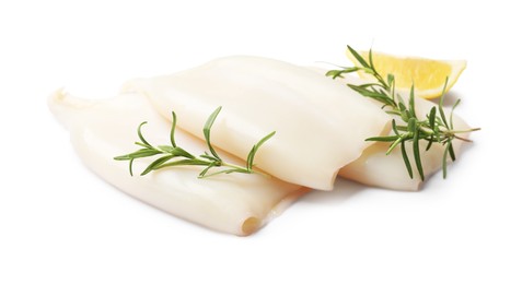 Photo of Pieces of raw squids with rosemary and lemon isolated on white