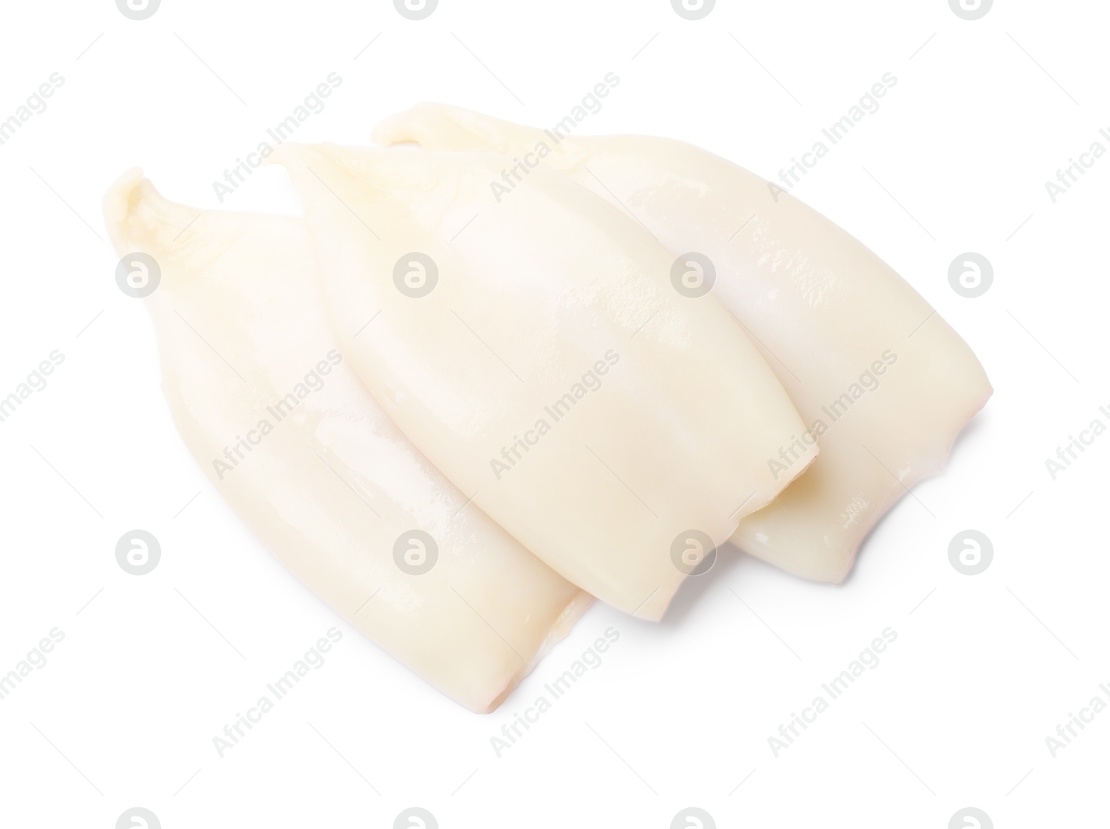 Photo of Pieces of raw squids isolated on white, top view
