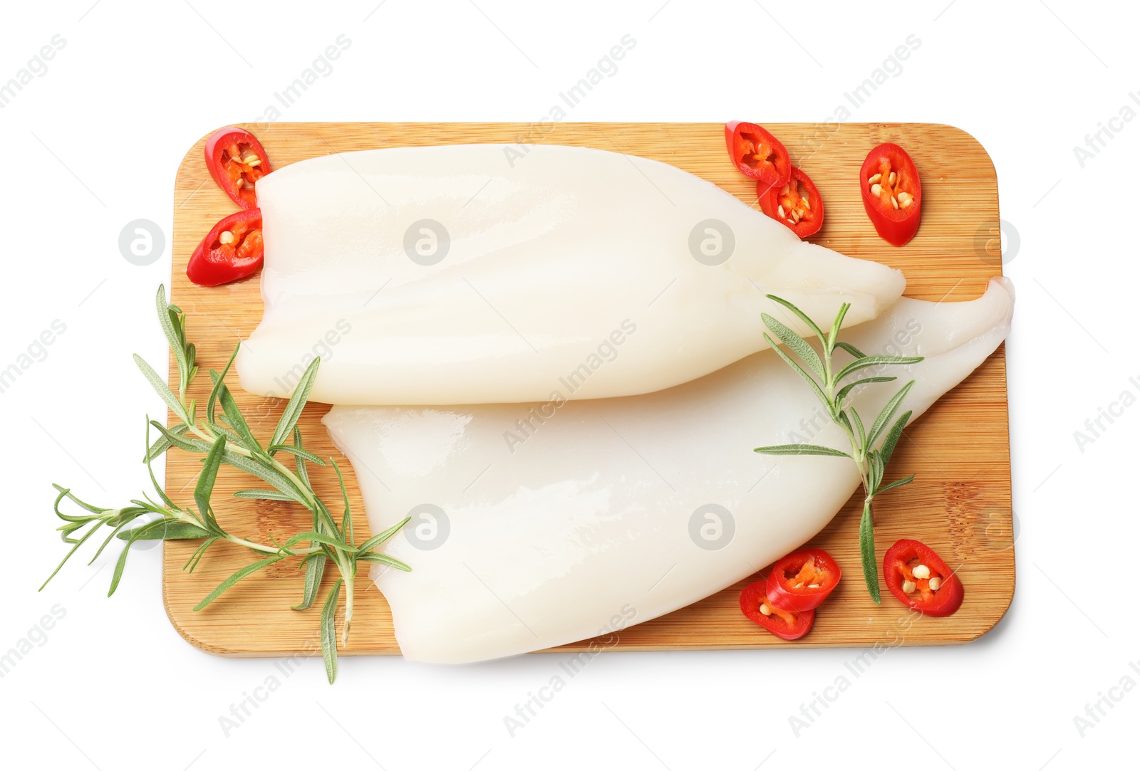 Photo of Pieces of raw squids with rosemary and chili pepper isolated on white, top view
