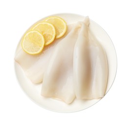 Photo of Pieces of raw squids with lemon isolated on white, top view