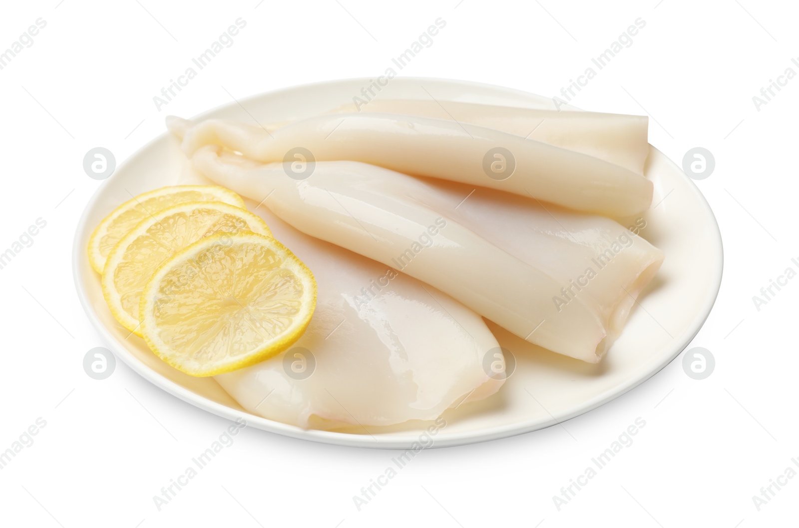 Photo of Pieces of raw squids with lemon isolated on white