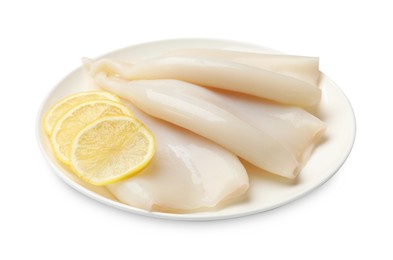 Photo of Pieces of raw squids with lemon isolated on white