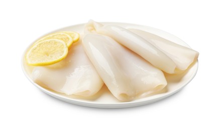 Photo of Pieces of raw squids with lemon isolated on white
