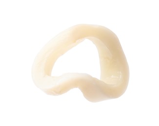 Photo of One raw squid ring isolated on white