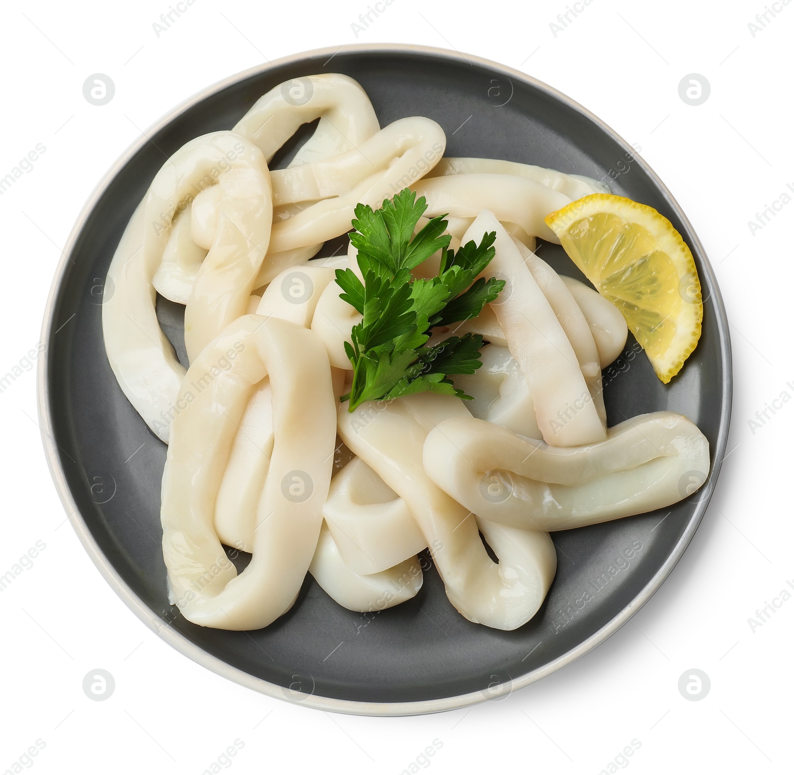 Photo of Raw squid rings, parsley and lemon isolated on white, top view