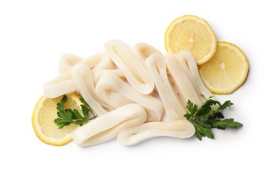 Photo of Pile of raw squid rings, lemon and parsley isolated on white, top view