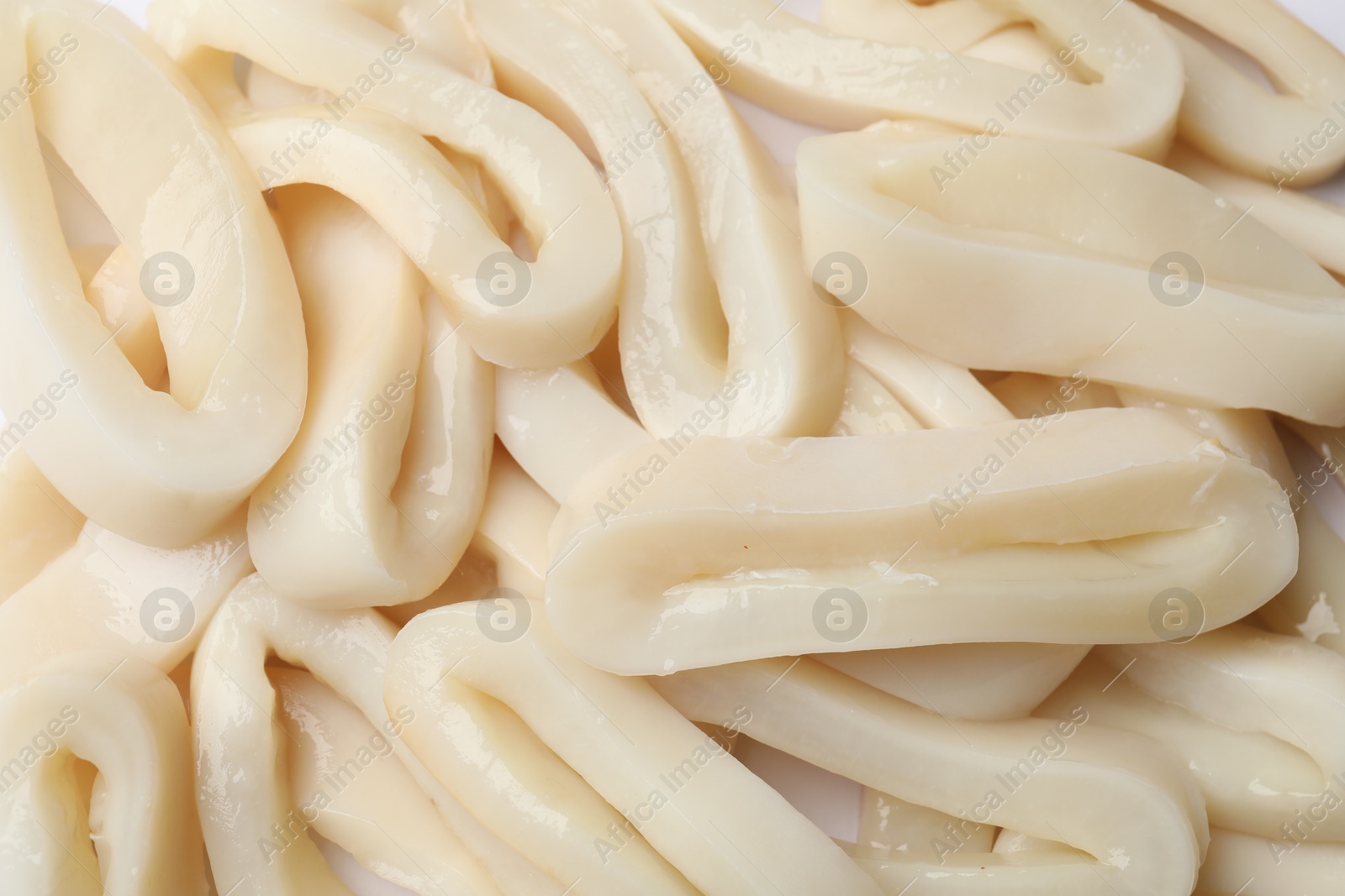 Photo of Raw squid rings as background, top view