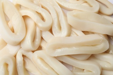 Photo of Raw squid rings as background, top view