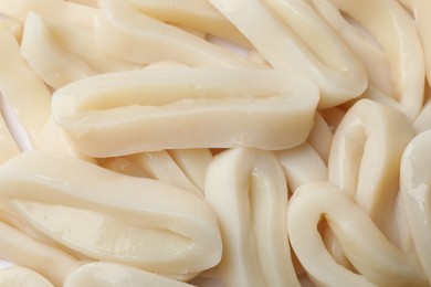 Photo of Raw squid rings as background, top view