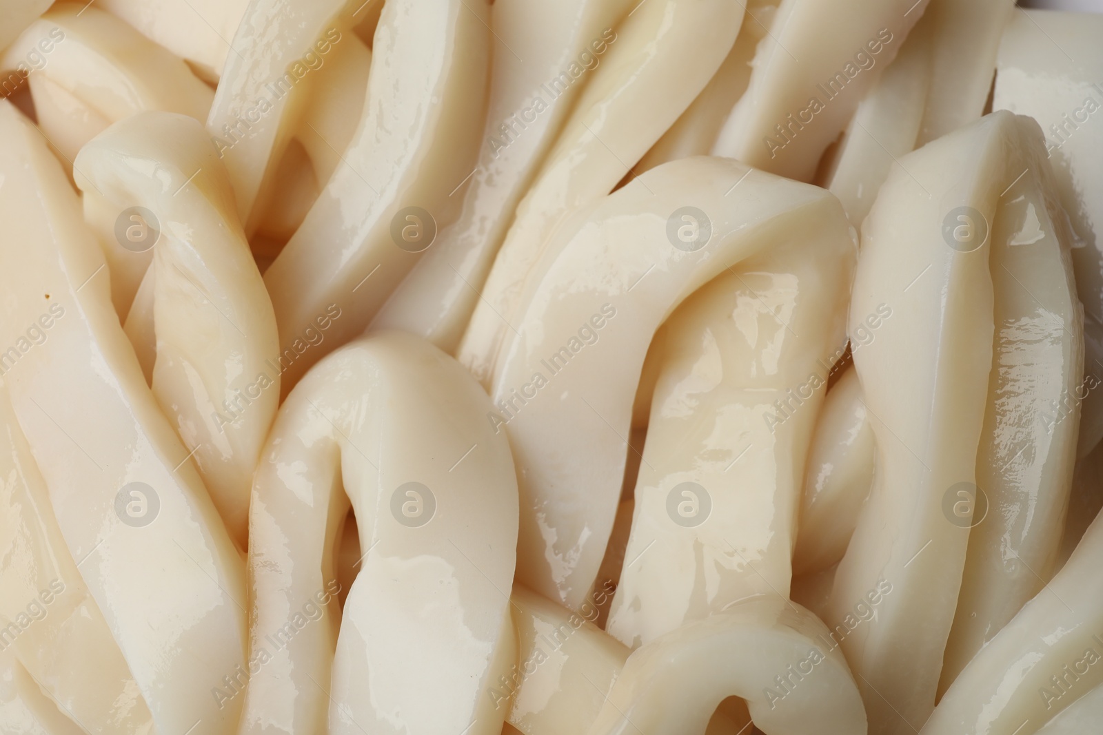 Photo of Raw squid rings as background, top view