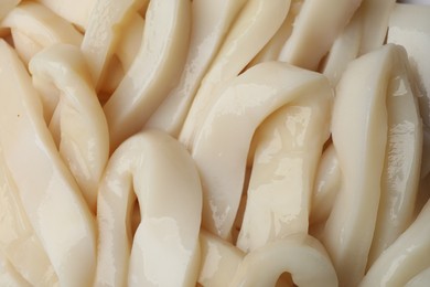 Photo of Raw squid rings as background, top view