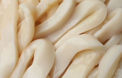 Photo of Raw squid rings as background, top view