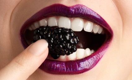 Photo of Woman with beautiful lips makeup and blackberry, closeup