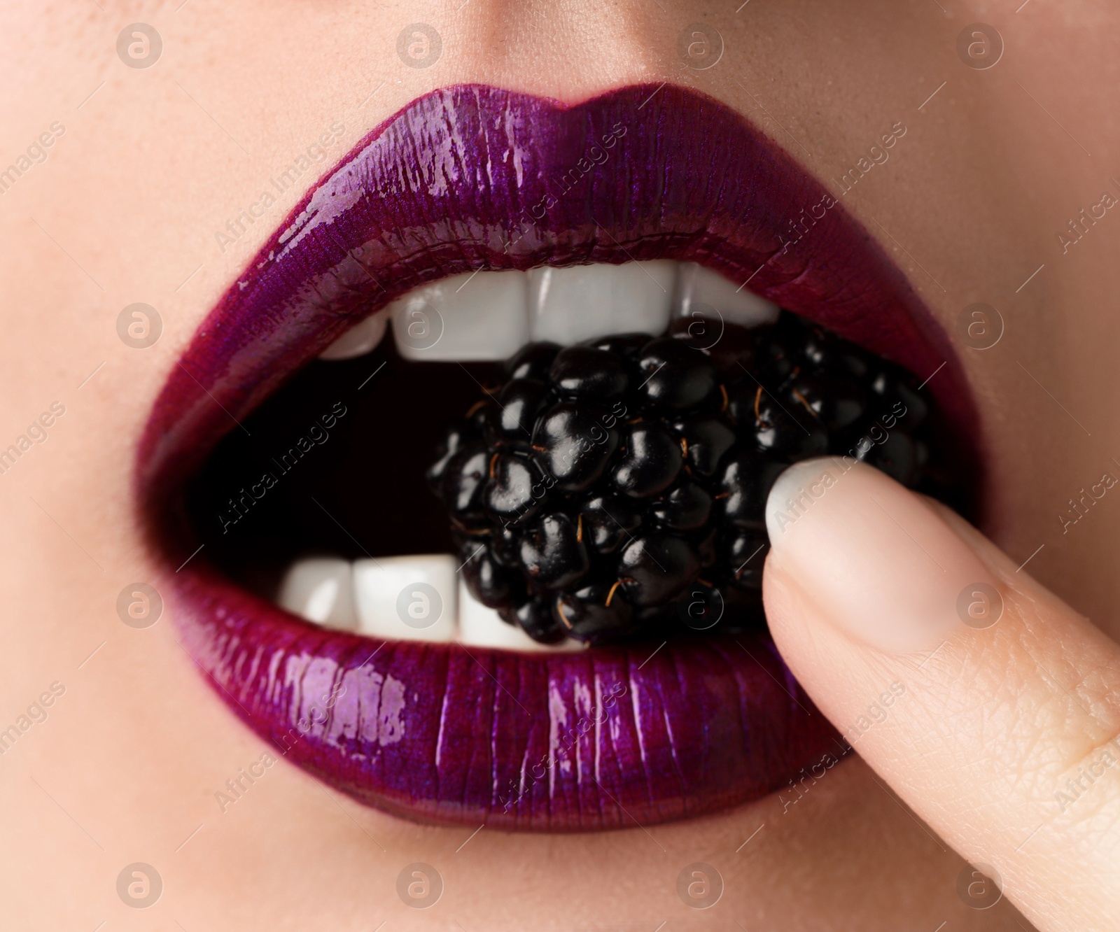 Photo of Woman with beautiful lips makeup and blackberry, closeup