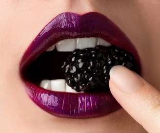 Photo of Woman with beautiful lips makeup and blackberry, closeup