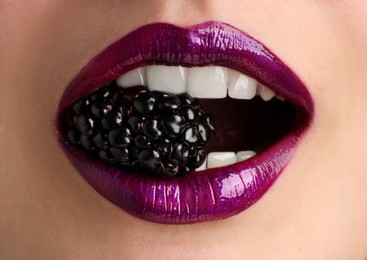 Photo of Woman with beautiful lips makeup and blackberry, closeup