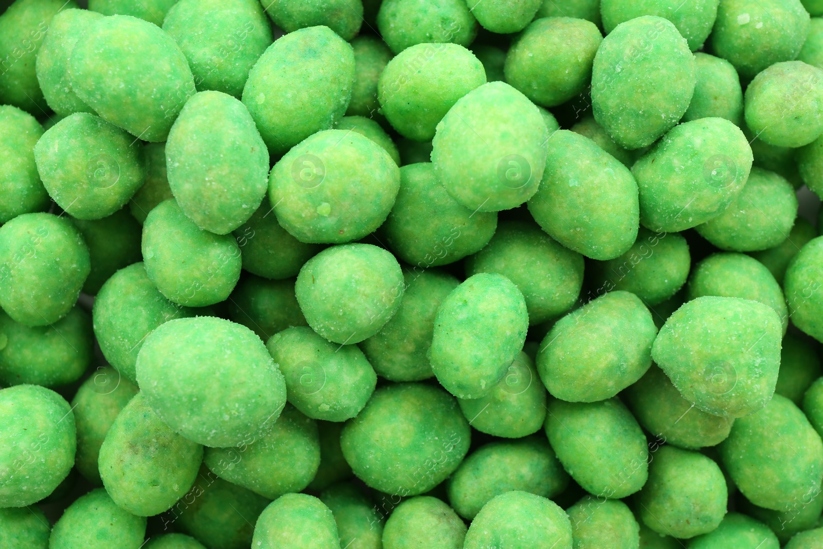 Photo of Tasty wasabi coated peanuts as background, closeup