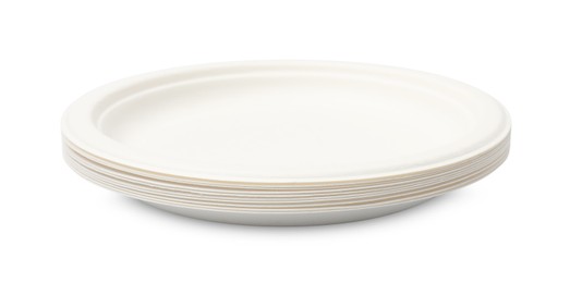 Photo of Disposable tableware. Stack of paper plates isolated on white