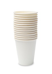 Photo of Disposable tableware. Stack of paper cups isolated on white