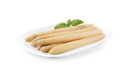 Photo of Pickled asparagus spears with basil isolated on white