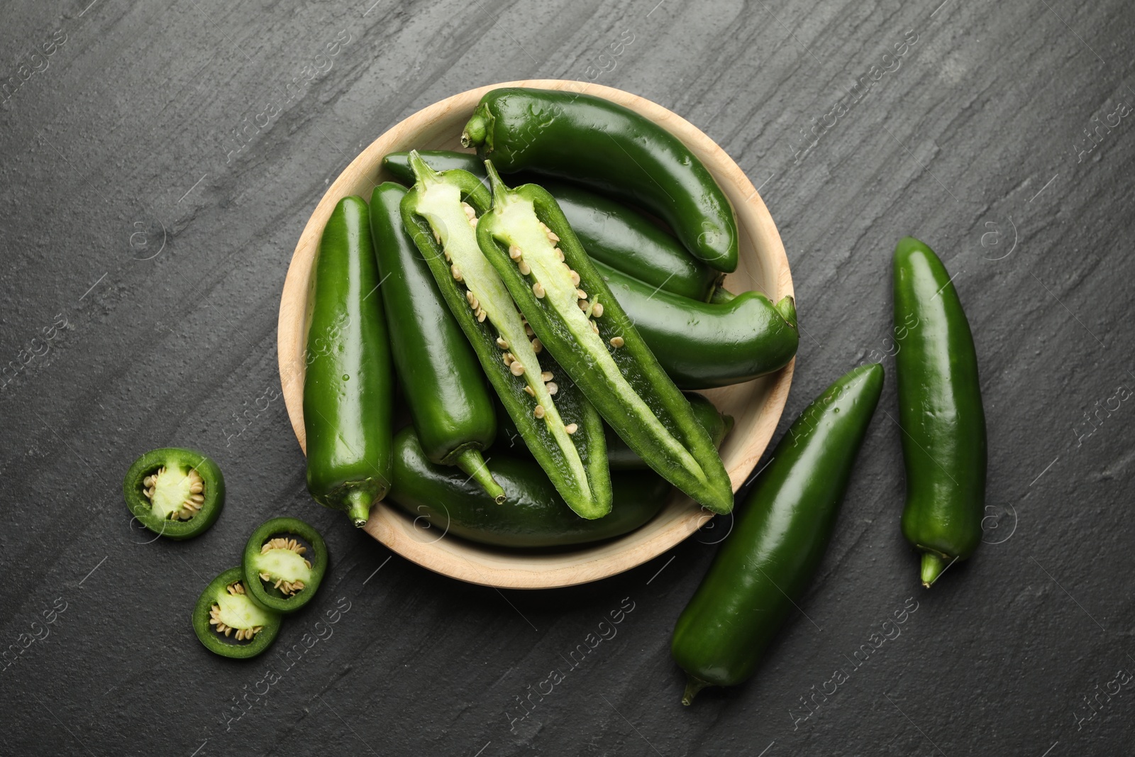 Photo of Ripe green jalapeno peppers on grey table, flat lay