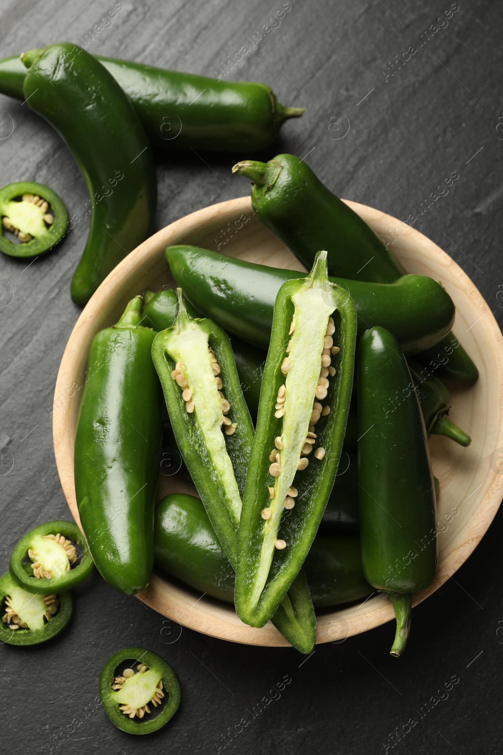 Photo of Ripe green jalapeno peppers on grey table, flat lay