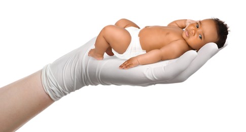 Image of In vitro fertilization (IVF). Cute little baby in doctor's hand against white background