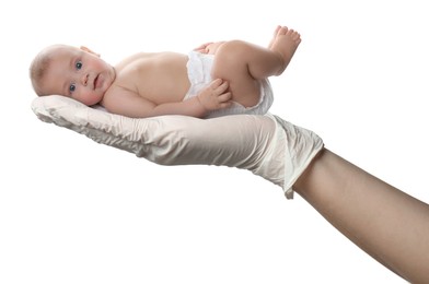 Image of In vitro fertilization (IVF). Cute little baby in doctor's hand against white background