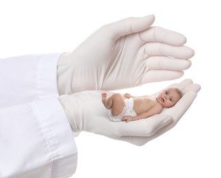 Image of In vitro fertilization (IVF). Doctor holding little baby in hand against white background