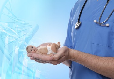Image of In vitro fertilization (IVF). Doctor holding little baby in hands against light blue background with test tubes and DNA