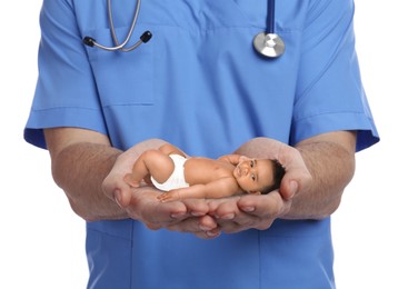 Image of In vitro fertilization (IVF). Doctor holding little baby in hands against white background