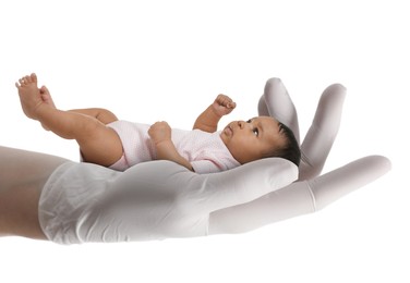 Image of In vitro fertilization (IVF). Cute little baby in doctor's hand against white background