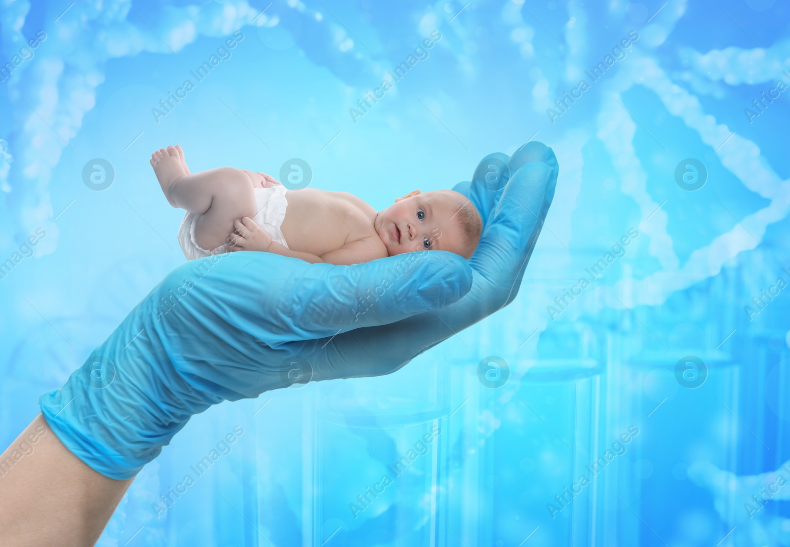 Image of In vitro fertilization (IVF). Cute little baby in doctor's hand against light blue background with test tubes and DNA