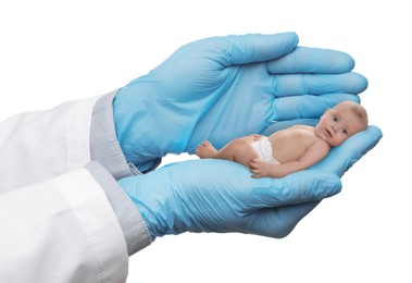 Image of In vitro fertilization (IVF). Doctor holding little baby in hand against white background