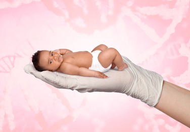 Image of In vitro fertilization (IVF). Cute little baby in doctor's hand against pink background with DNA