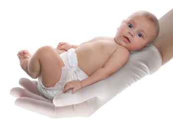 Image of In vitro fertilization (IVF). Cute little baby in doctor's hand against white background