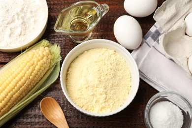 Photo of Different ingredients for corn bread on wooden table, flat lay