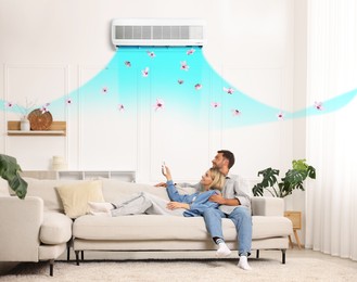 Image of Couple resting on sofa in room with air conditioner