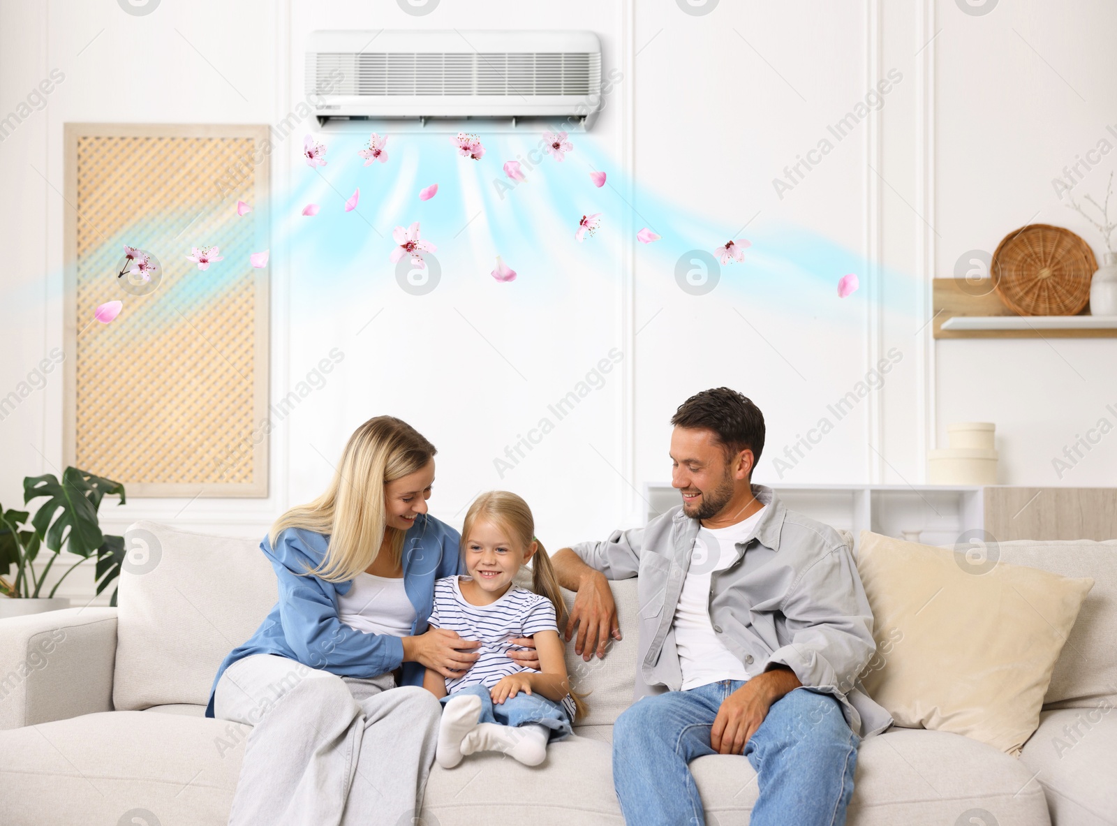 Happy family on sofa in room with air conditioner Image of Happy family on sofa in room with air conditioner