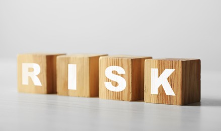 Image of Word Risk of wooden cubes with letters on table