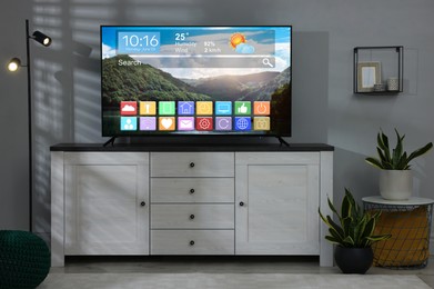 Image of TV set in room. Menu with icons and information on display