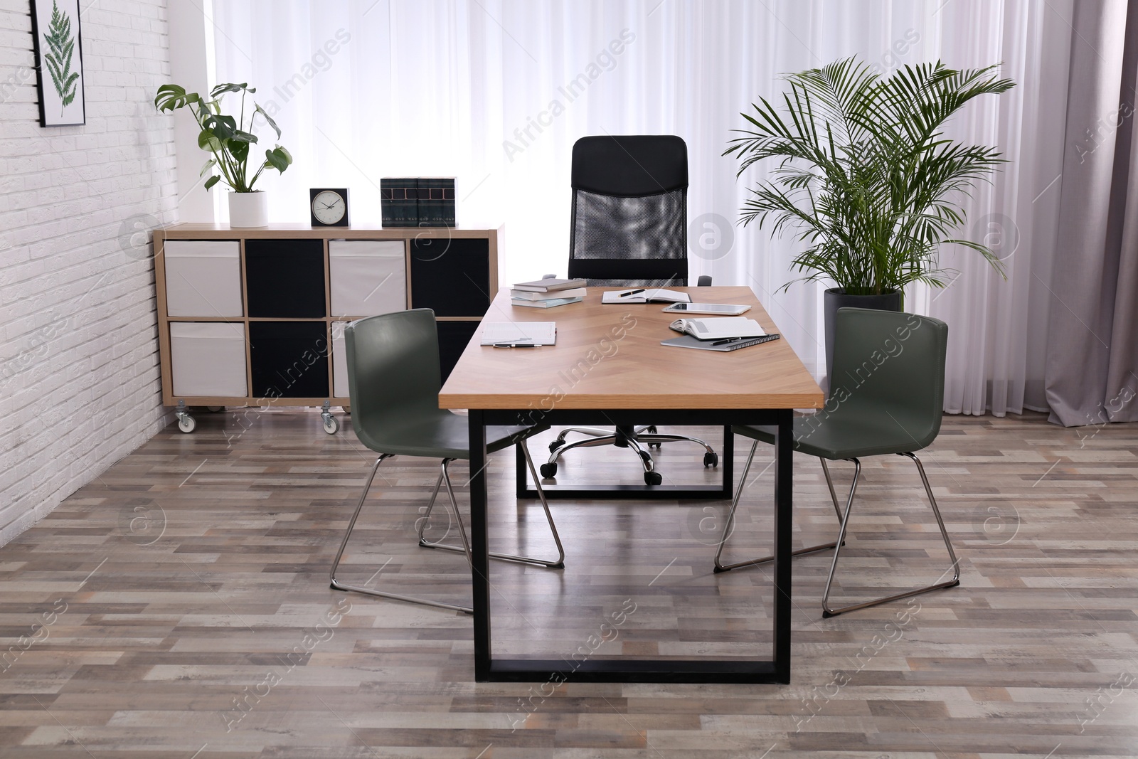 Photo of Director's office with large wooden table. Interior design