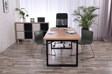 Photo of Director's office with large wooden table. Interior design