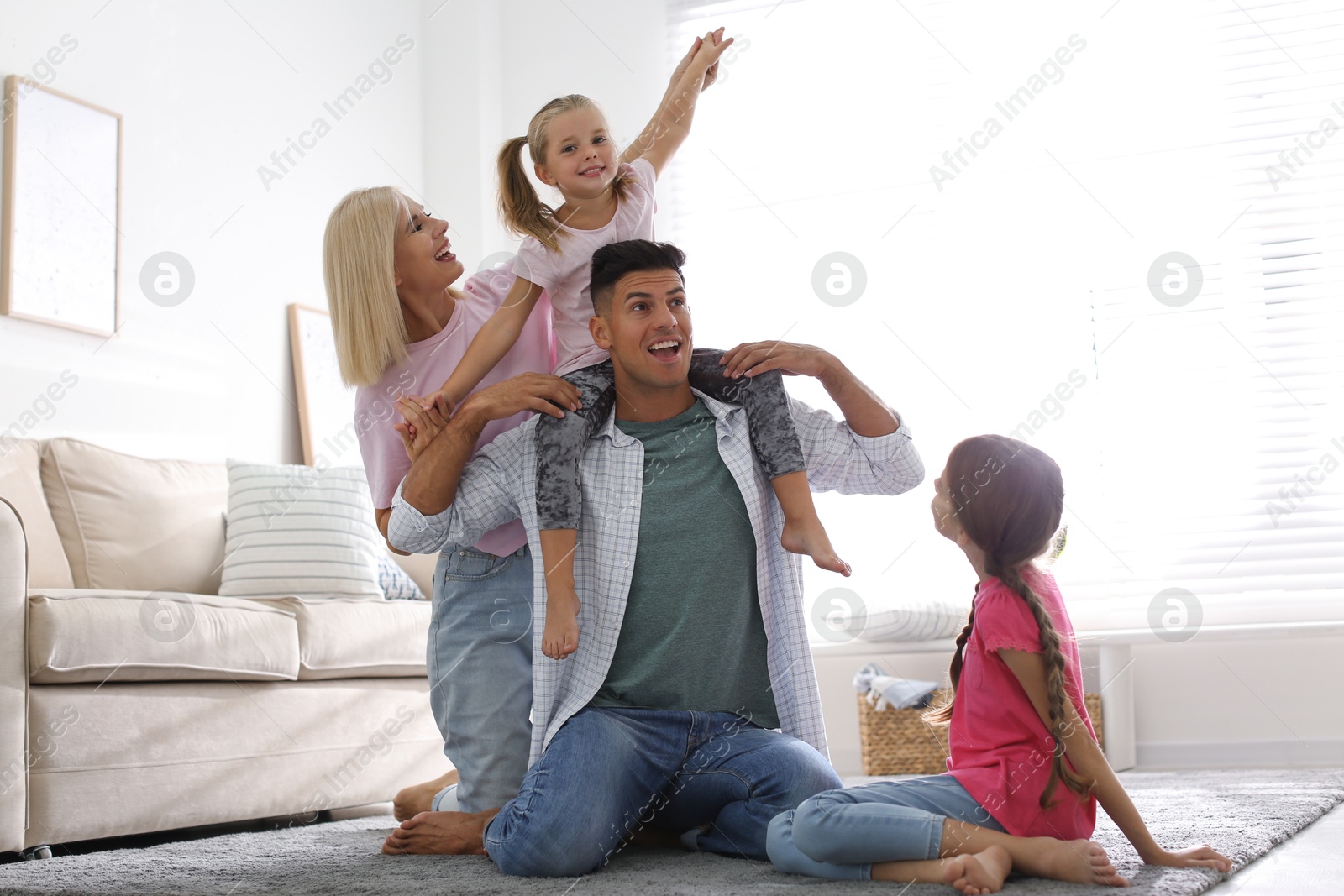 Photo of Happy family spending time together at home