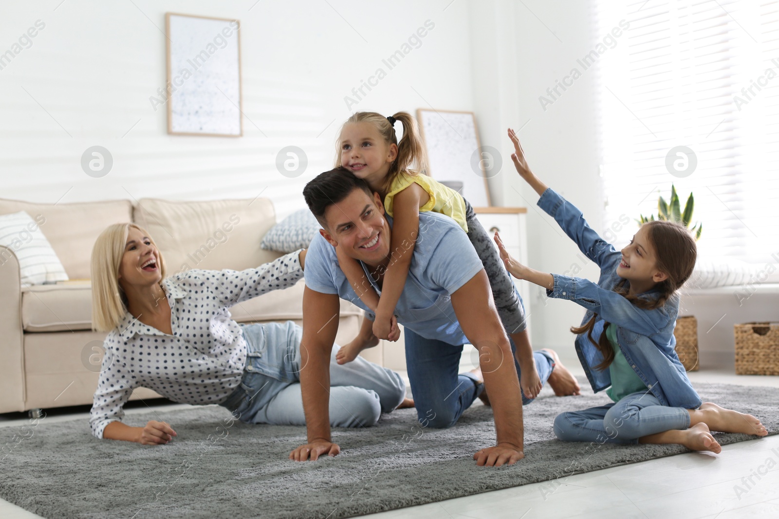 Photo of Happy family spending time together at home